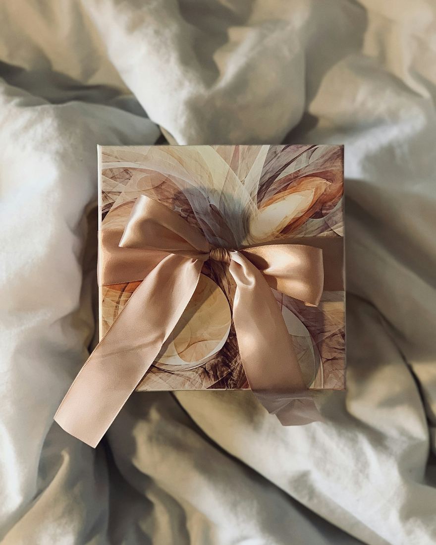 A gift box tied with a satin ribbon